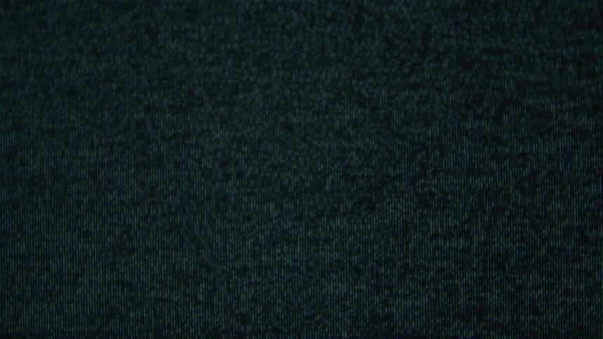 A flickering black screen with a many black and white pixel effect