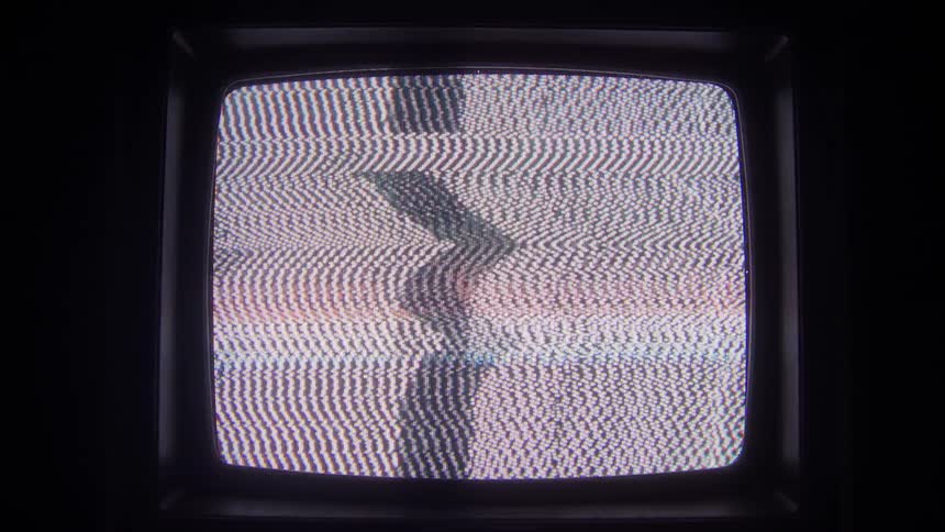 Static and colored bars flash on the screen