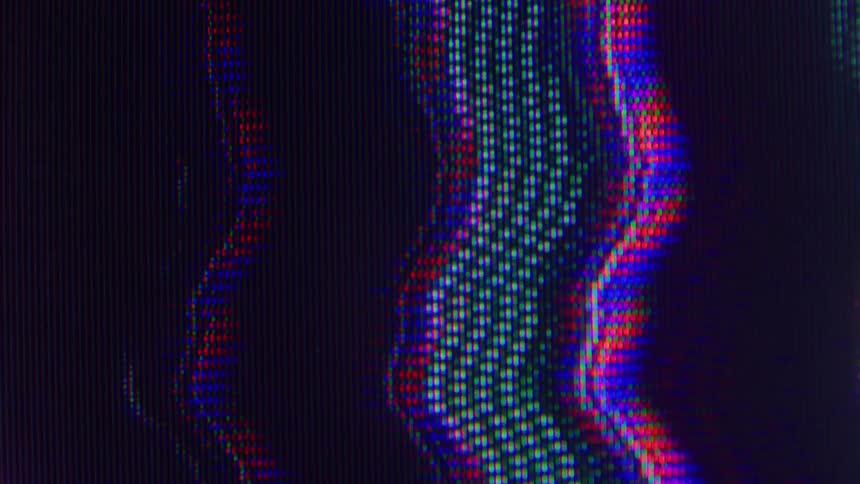 A closeup of a glitchy crt screen shows wavy bands of rgb pixels and fine scanlines