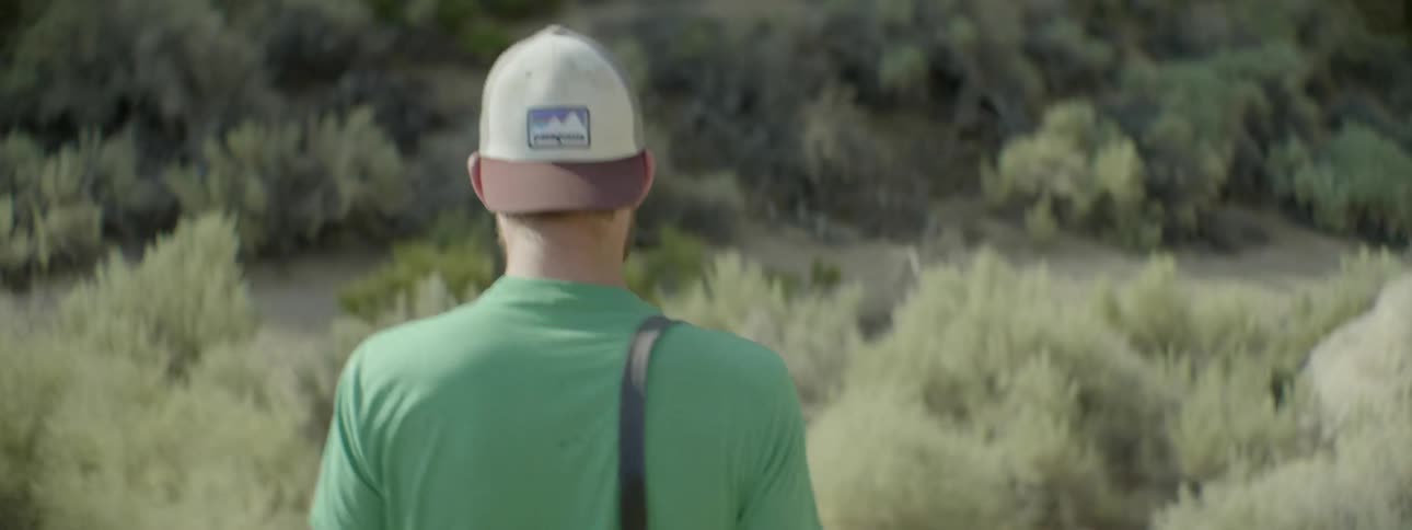 A man is hiking in the wilderness