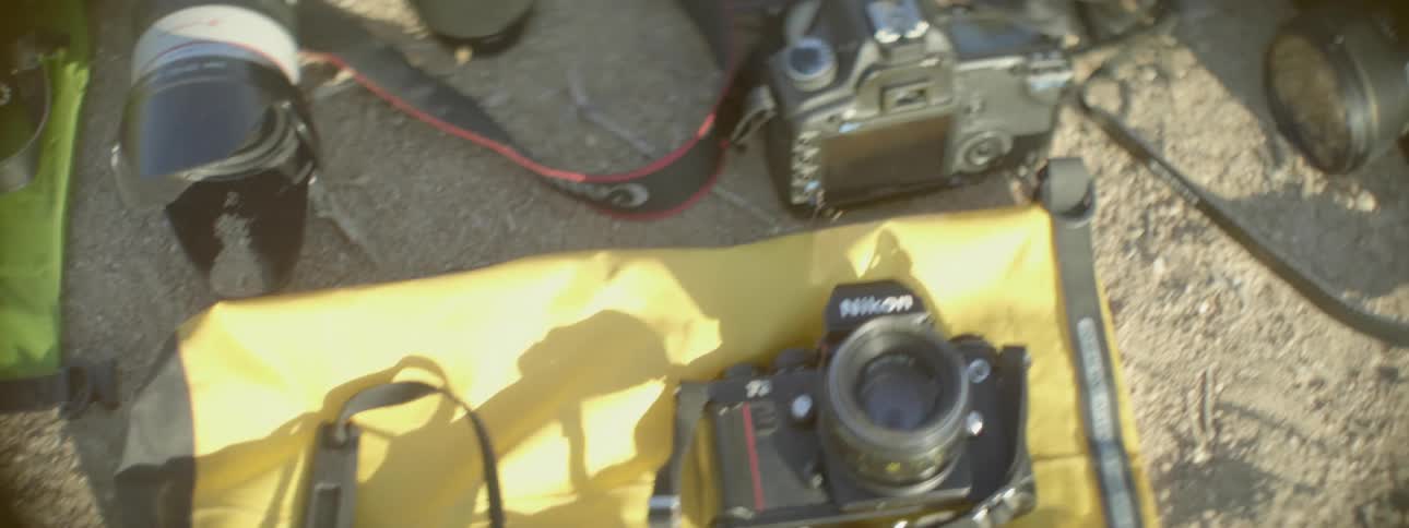 Camera equipment is laid out on the ground