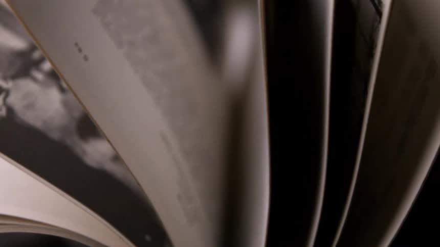 Pages of a book flip through the air