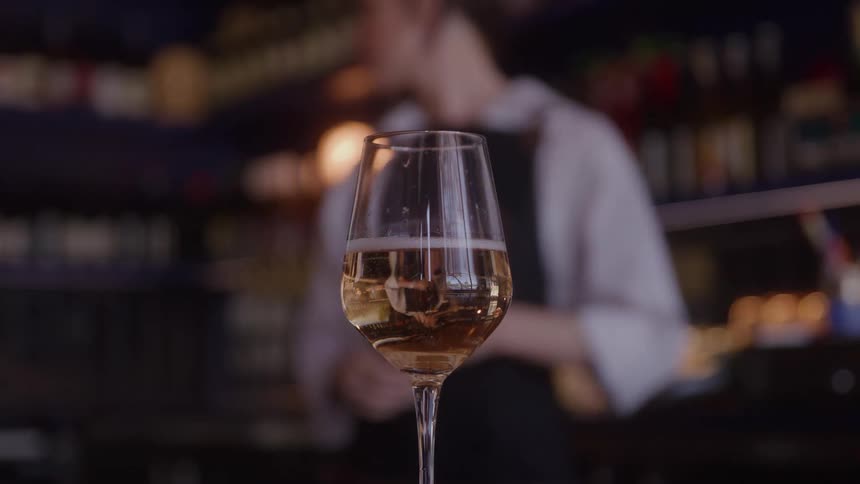 A white wine glass on the bar
