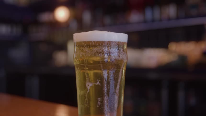A foaming glass of beer