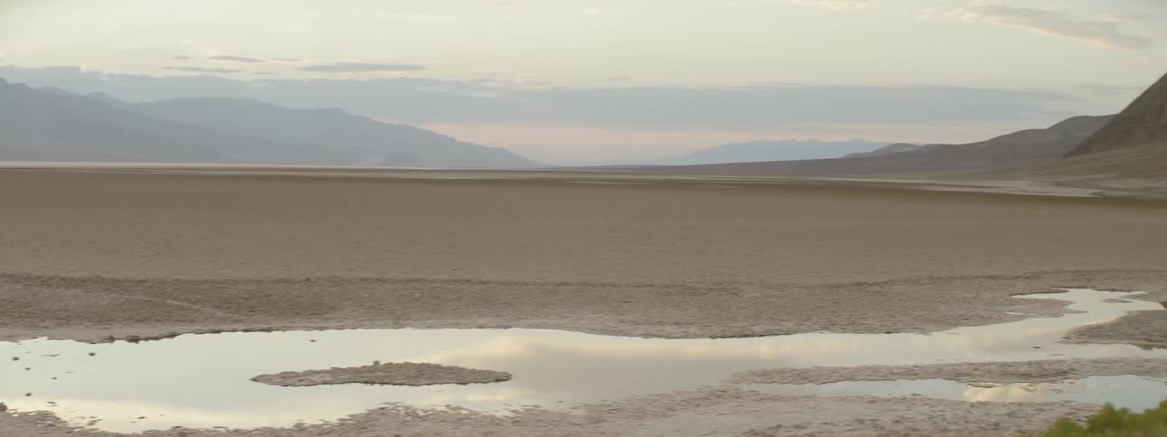 A small pond sits on this desert field