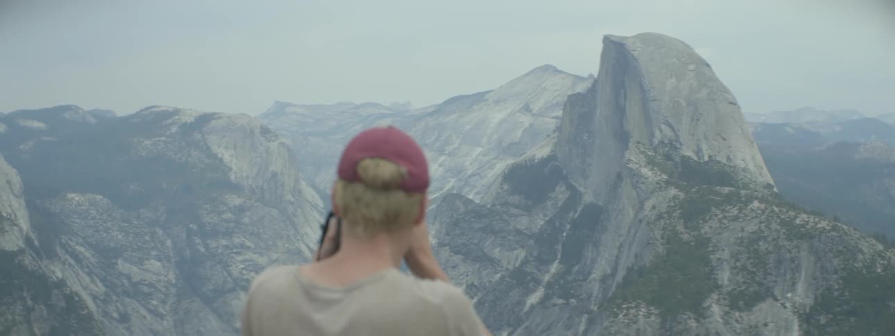 Man taking photographs of landmarks in yosemite national park