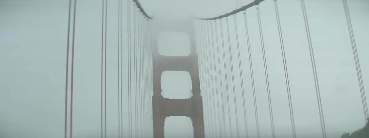 The wires for a suspension bridge stretch upwards