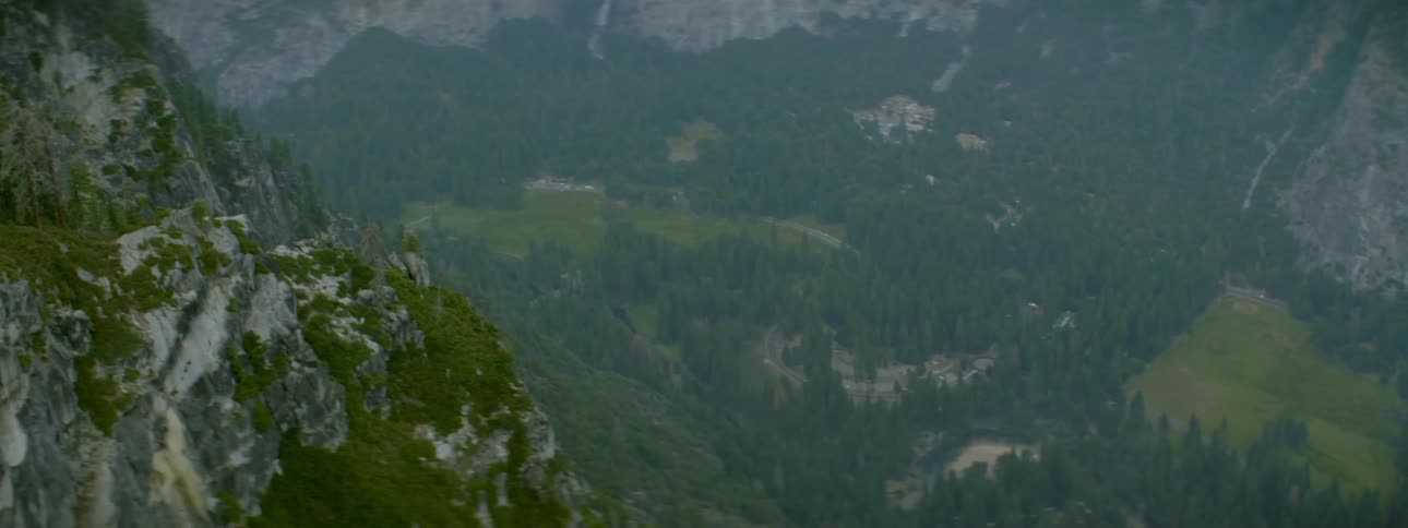 A mountain valley is shown on a sunny day
