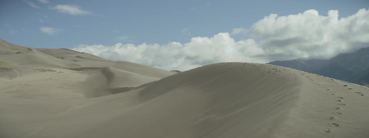 Tall dunes of sand fill this desert