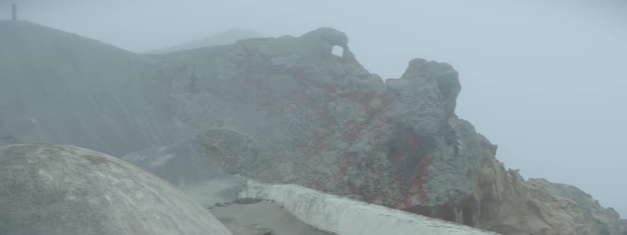 Heavy fog covers this mountain top