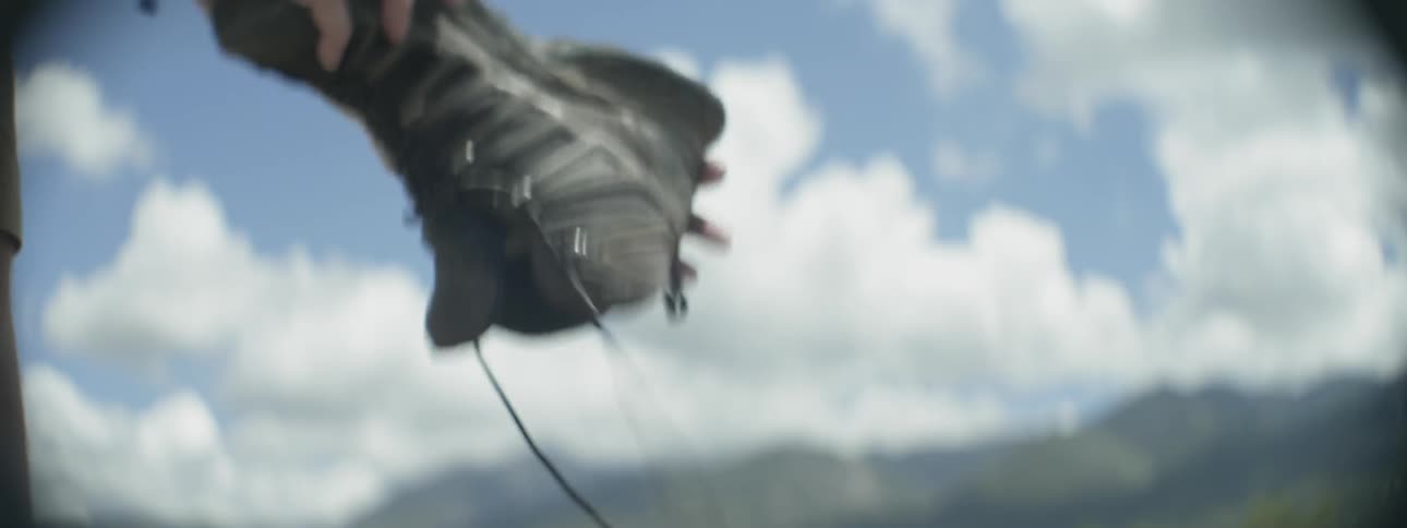 A person shakes and out of his shoe