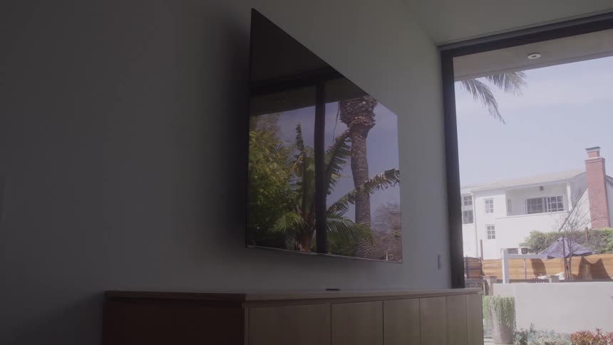 A television reflects the outside
