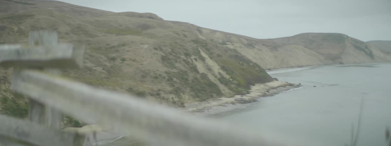 A body of water near a large hill