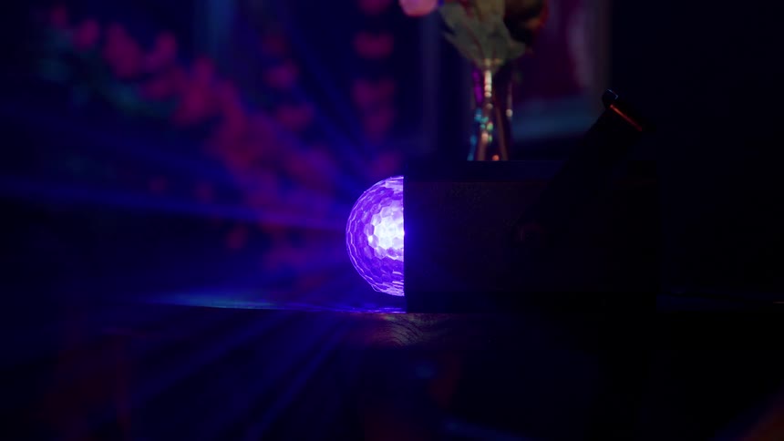 Rays of light come from the glowing orb