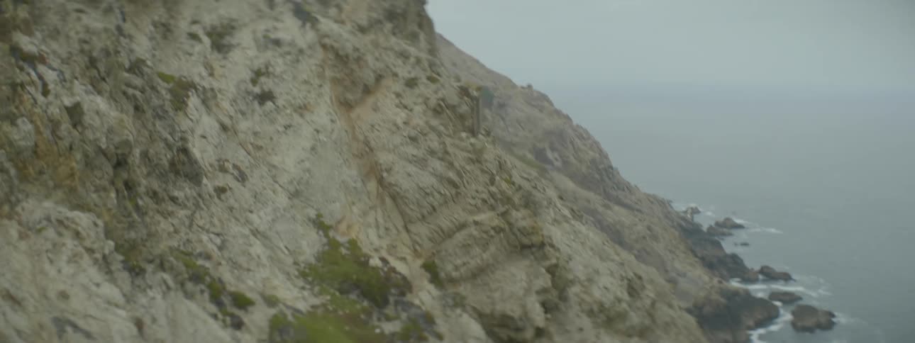 Waves crash against the rocks on this mountain