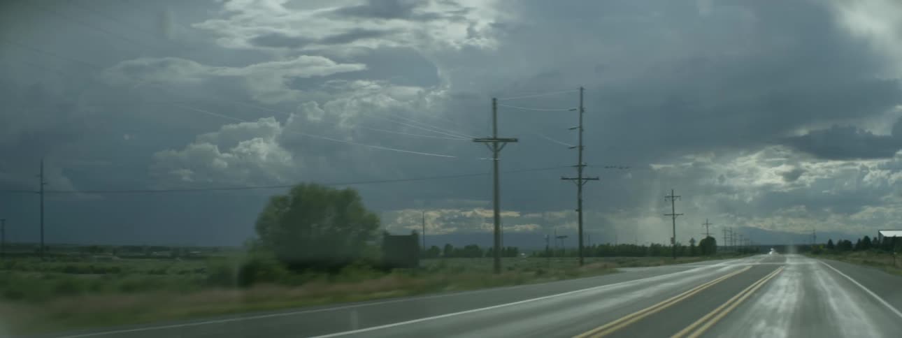 Traveling view of driving through the country on a cloudy day