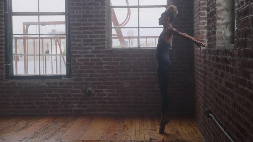 The woman is practicing ballet