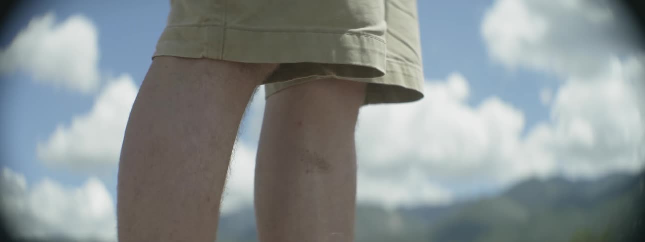 A hiker's knees are shown