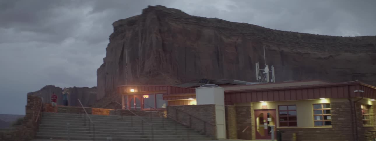 Lights are shining in outside a building in a scenic tourist destination