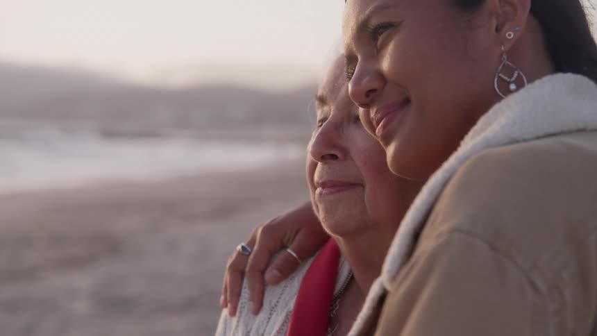 The woman hug on the beach