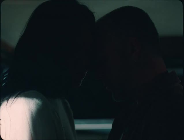 Couple touches foreheads in a silent gesture of affection