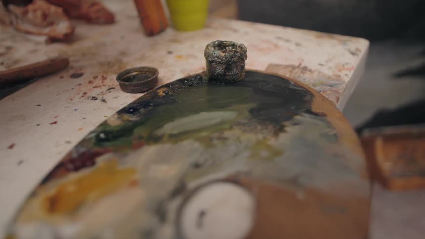 The painting supplies are covered in paint