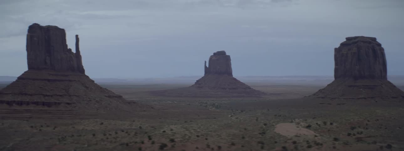 A rock formation stands in the distance