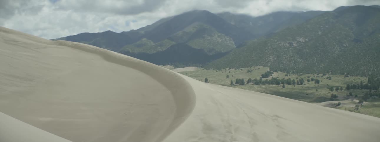 A sand dune on a cloudy day