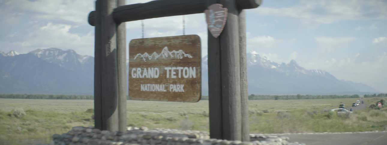Sign of grand teton national park as seen on a cloudy day