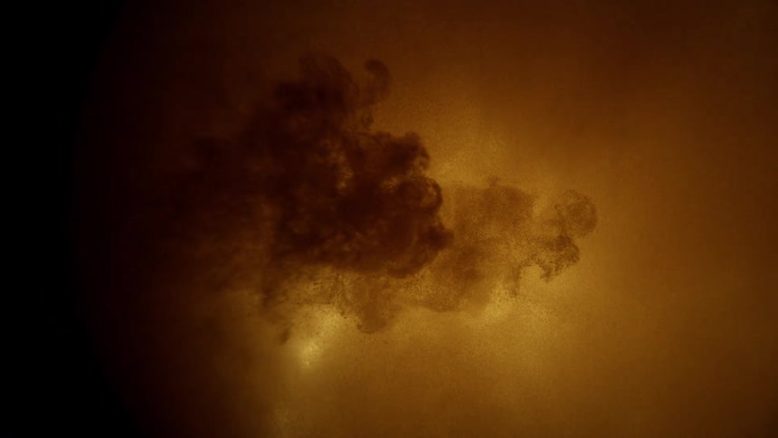 Dark cloud suspended in amber setting simulates liquid dispersion in lit environment