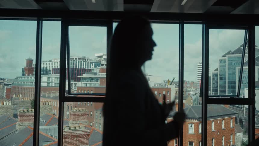 The woman gives a lecture in the office