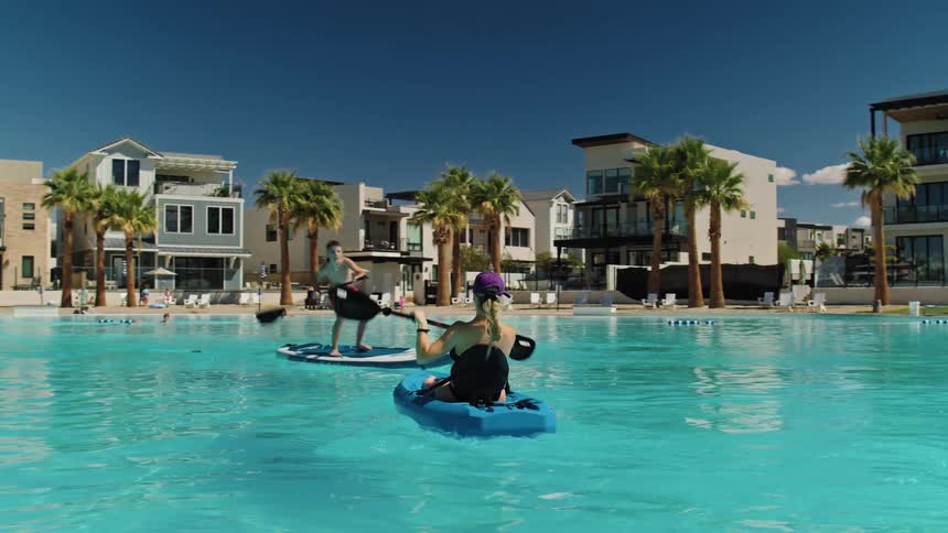 People have fun in the pool during vacation