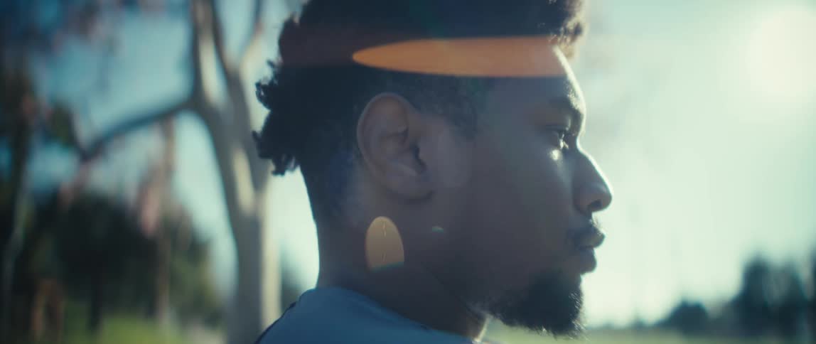 Man gazes at the horizon while reflecting under the sunlight