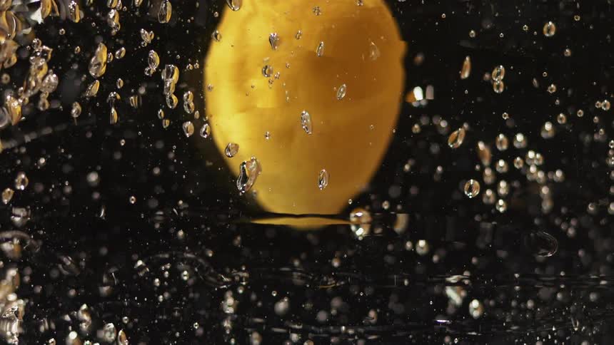 Fruit is moving around in liquid very slowly