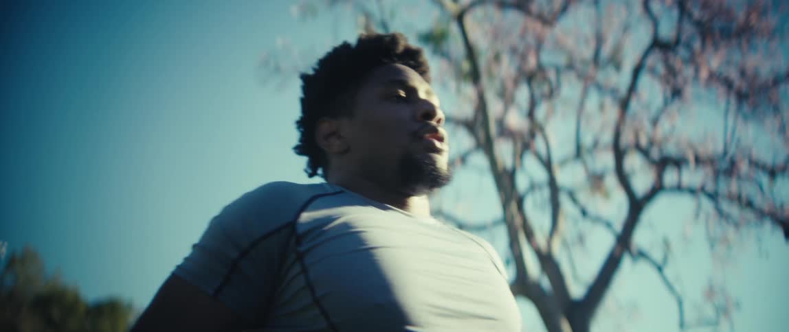 The man leans forward breathing heavy
