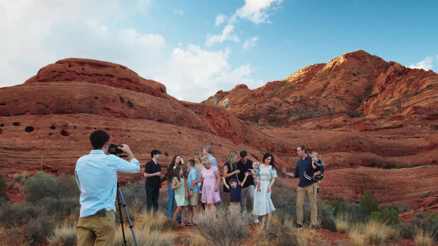 Family poses together amid the desert rock formations