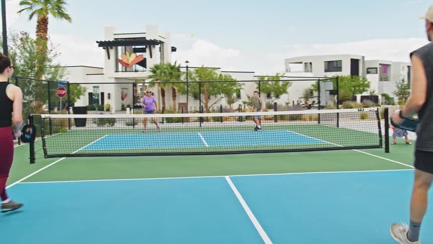 People are playing a game of pickleball