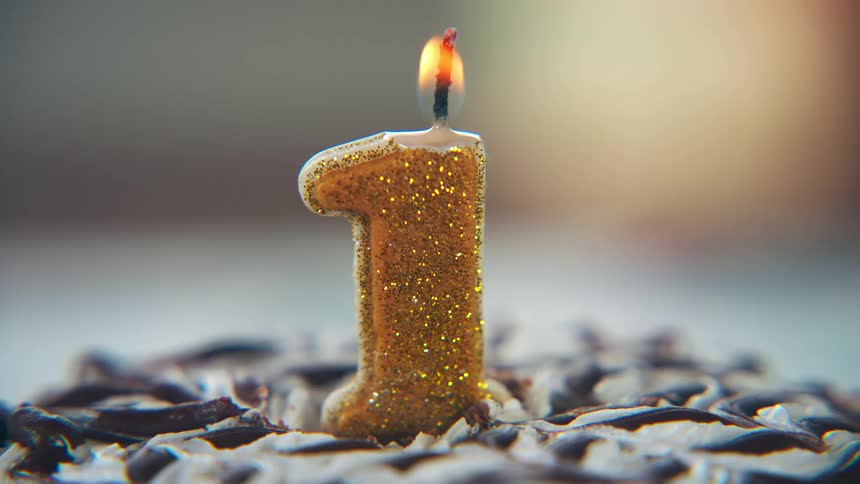 A number one candle is lit