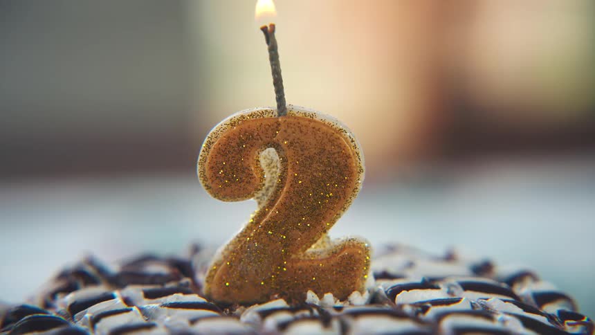The candle is lit on the birthday cake