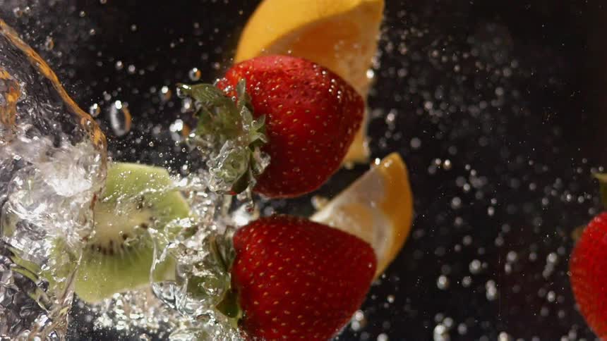 Fruits falling into water