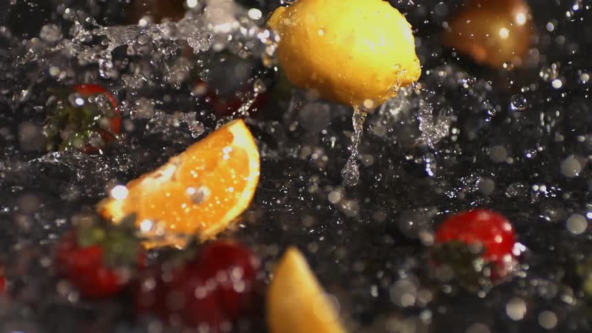 Fruit falls into a container of water