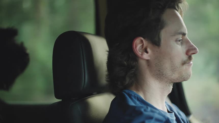A man inside a car driving