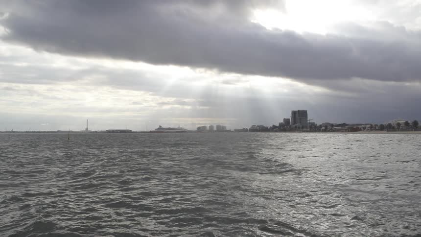 View of rough waters under a cloudy sky