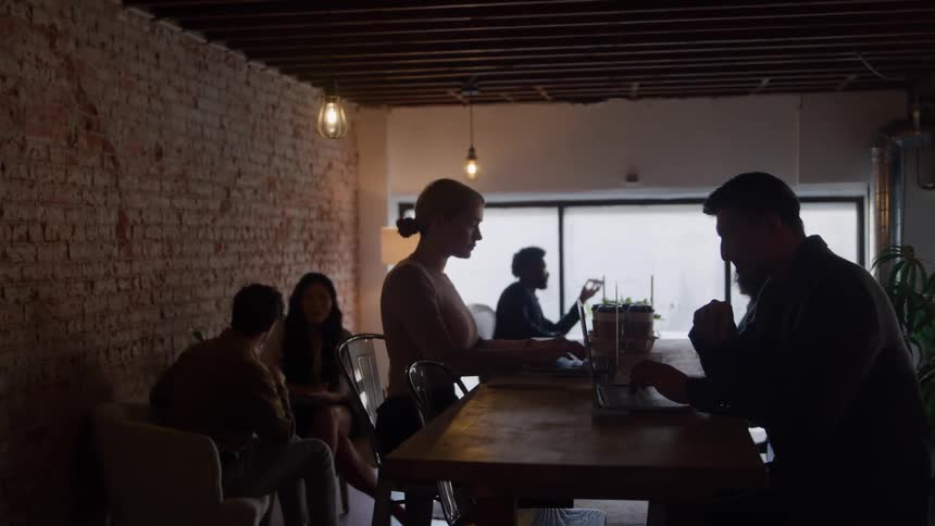 Customers sit and talk in the cafe