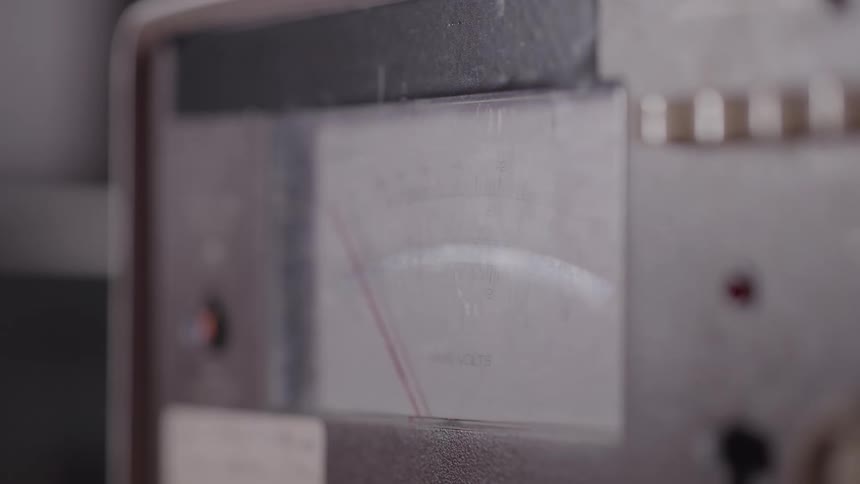 Analog meter with needle indicating value in rms volts
