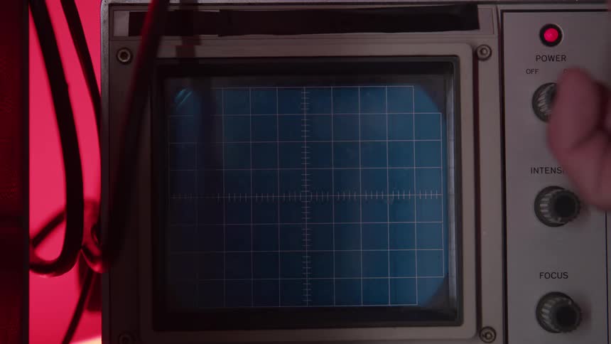 Green light dot on the screen of a poweredon oscilloscope