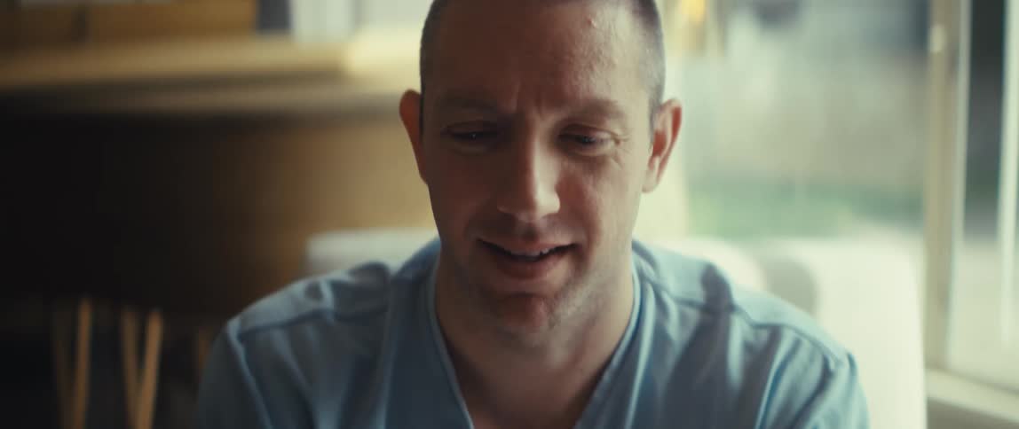 Man holds a smartphone horizontally focused on what he sees