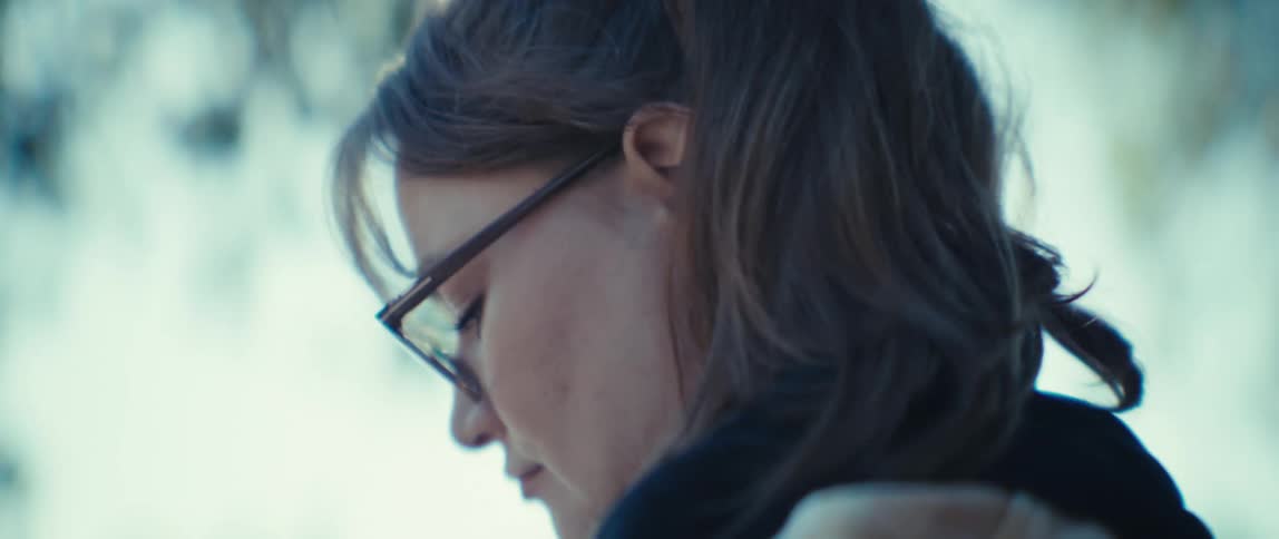 Woman outdoors writing