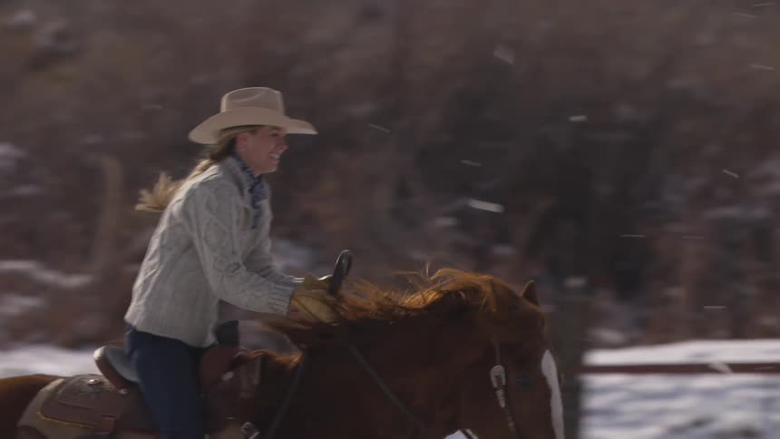 A woman horseback riding