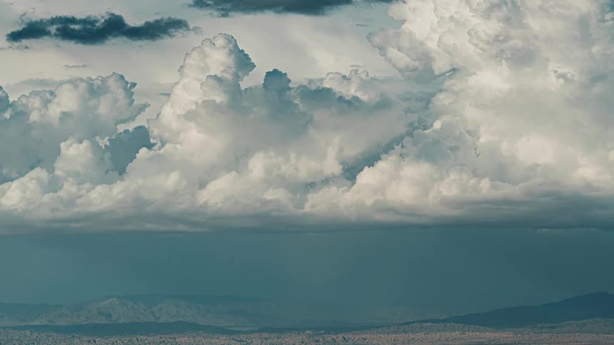 Cumulus clouds move over the landscape